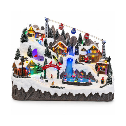 Beleuchtetes Weihnachtsdorf mit beweglichen Ski- und Schlittschuhbahnen, LED-Lichtern und Musik – 56x37x42 cm