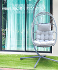 Hängesessel Gaia Grey aus grauem Polyrattan mit Stahlgestell, Kissen und einer Tragfähigkeit von 140 kg, EAN 8023755069100