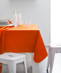bild-4-i-casamici-set-100-tovaglie-tnt-monosuo-arancio-140x140cm-ean-8056304644152